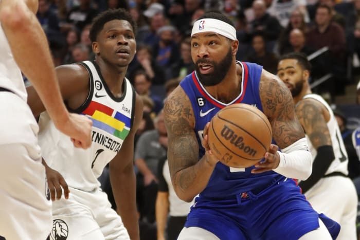 Jan 6, 2023; Minneapolis, Minnesota, USA; Los Angeles Clippers forward Marcus Morris works to the basket past Minnesota Timberwolves forward Anthony Edwards (1) in the third quarter at Target Center.